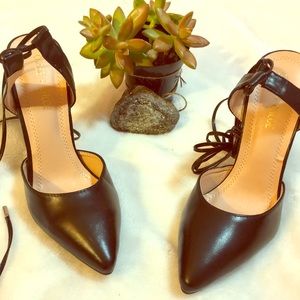 All black lace up stiletto heels by Chase + Chloe